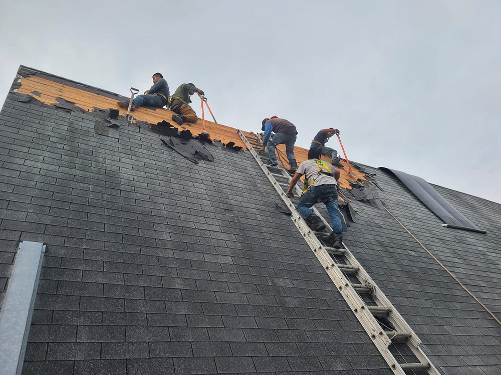 workers repairing a residential roof